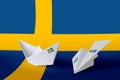 Sweden flag depicted on paper origami airplane and boat. Handmade arts concept Royalty Free Stock Photo