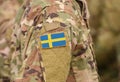 Sweden flag on soldiers arm collage Royalty Free Stock Photo