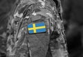 Sweden flag on soldiers arm collage Royalty Free Stock Photo