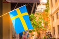 Sweden flag on a street in the Gamla Stan, old town of Stockholm, Sweden Royalty Free Stock Photo