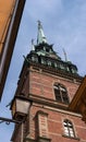 Sweden, Stockholm, on an old street in Gamlastan. The ancient part of the city. The bell tower of the German church Royalty Free Stock Photo