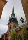 Sweden, Stockholm, on an old street in Gamlastan. The ancient part of the city. The bell tower of the German church Royalty Free Stock Photo