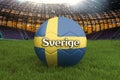 Sweden on Swedish language on football team ball on big stadium background. Sweden Team competition concept. Sweden flag on ball t