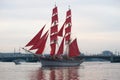 The Swedish brig `Three Crowns` Tre Cronor with red sails on a white night. Fragment of rehearsal for the holiday `Scarlet Sails