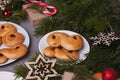 Swedish christmas. Traditional swedish buns on cake stand in christmas setting. A saffron bun, in Swedish lussebulle or lussekatt. Royalty Free Stock Photo