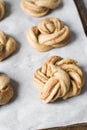 Swedish cinnamon buns dough on a parchment lined baking pan