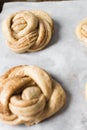 Swedish cinnamon buns dough on a parchment lined baking pan