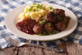 Swedish cuisine: meatballs, lingonberry sauce, potato closeup. h Royalty Free Stock Photo