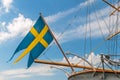 Swedish flag on the back of an old sailing ship Royalty Free Stock Photo
