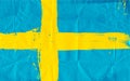 Swedish flag daubed with paint