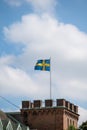 Swedish flag on pole on fortress like building in Lund Sweden on national day Royalty Free Stock Photo