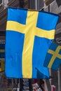 Swedish flag on VÃÂ¤sterlÃÂ¥nggatan Stockholm Royalty Free Stock Photo