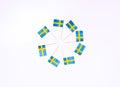 Swedish flags in the shape of circle on the white background. Swedish flag concept. Scandinavian