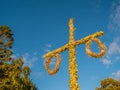 Swedish maypole used on midsummer or midsommar in sun set light. Royalty Free Stock Photo