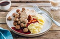 Swedish meatballs kottbullar, mashed potato, onion sauce and lingonberry sauce. Royalty Free Stock Photo