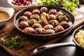 Swedish meatballs, kottbullar, in a pan topped with fresh parsley Royalty Free Stock Photo