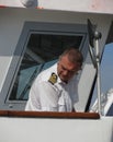 Swedish navy sailor overste piloting a ferry Royalty Free Stock Photo