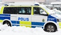 Swedish Police cars parked a winter day when it is snowing outside the main train station, Stockholm central station