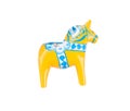 Swedish traditional souvenir wooden Dala or Dalecarlian horse, yellow colored, isolated on white