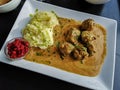 Swedish typical dish consisting of meatballs with sauce or gravy, mashed potatoes and ribes, covered with sprinkling parsley