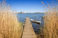 Swedish wooden bridge with old boat Royalty Free Stock Photo