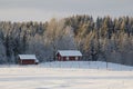 Swedish wooden houses in snowy scenic winter landscape