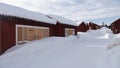 Swedish wooden red church houses in Lovanger kyrkstad in winter in Sweden