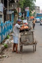 A sweeper sweeps the street of Kolkata, India on October 2020 Royalty Free Stock Photo