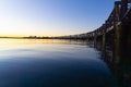 Sweeping lines of Tauranga`s historic railway bridge across harbor, New Zealand