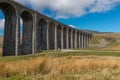 The sweeping magnificent Ribblehead Viaduct stands tall above the Ribble Valley, carrying the Settle to Carlise railway Royalty Free Stock Photo