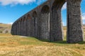 The sweeping majestic Ribblehead Viaduct stands tall above the Ribble Valley, Yorkshire, England carrying the Settle to Carlise Royalty Free Stock Photo