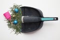 Sweeping up pine needles and broken decorations after Christmas holiday Royalty Free Stock Photo