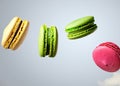 Sweet Airborne Treats: Close-Up of Flying Macaroons, a Celebration of Vibrant Indulgence