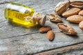 Sweet Almond oil in glass of bottle. Almonds nuts and oil concept Royalty Free Stock Photo