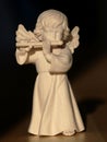 Sweet angel playing flute Royalty Free Stock Photo