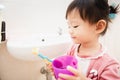 Sweet Asian child little girl brushing her teeth Royalty Free Stock Photo