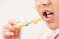 Sweet Asian child little girl brushing her teeth Royalty Free Stock Photo