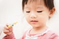 Sweet Asian child little girl brushing her teeth Royalty Free Stock Photo