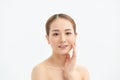 A sweet Asian girl with a clean perfect face closed her eyes with tenderness touching the skin Royalty Free Stock Photo