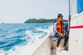 Weet Asian girl feel exhausted sitting on speed boat after hour