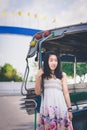 Sweet Asian Girl standing and enjoying riding on bus