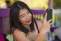 Sweet Asian girl taking selfie with hand phone . young beautiful and happy Korean woman taking self portrait photo smiling Royalty Free Stock Photo