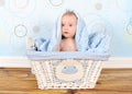 Sweet baby boy in basket with blanket on head Royalty Free Stock Photo