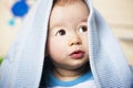 Sweet baby boy with blue blanket. Royalty Free Stock Photo