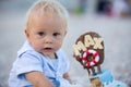 Sweet baby boy, celebrating first birthday with sea theme cake and decoration Royalty Free Stock Photo