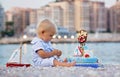 Sweet baby boy, celebrating first birthday with sea theme cake and decoration Royalty Free Stock Photo