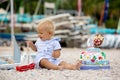 Sweet baby boy, celebrating first birthday with sea theme cake and decoration Royalty Free Stock Photo