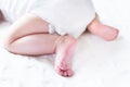 Sweet baby feet on a white blanket Royalty Free Stock Photo