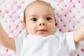 Sweet baby girl lying on knitted plush blanket Royalty Free Stock Photo