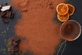 Cocoa powder in a sieve over black slate background Royalty Free Stock Photo